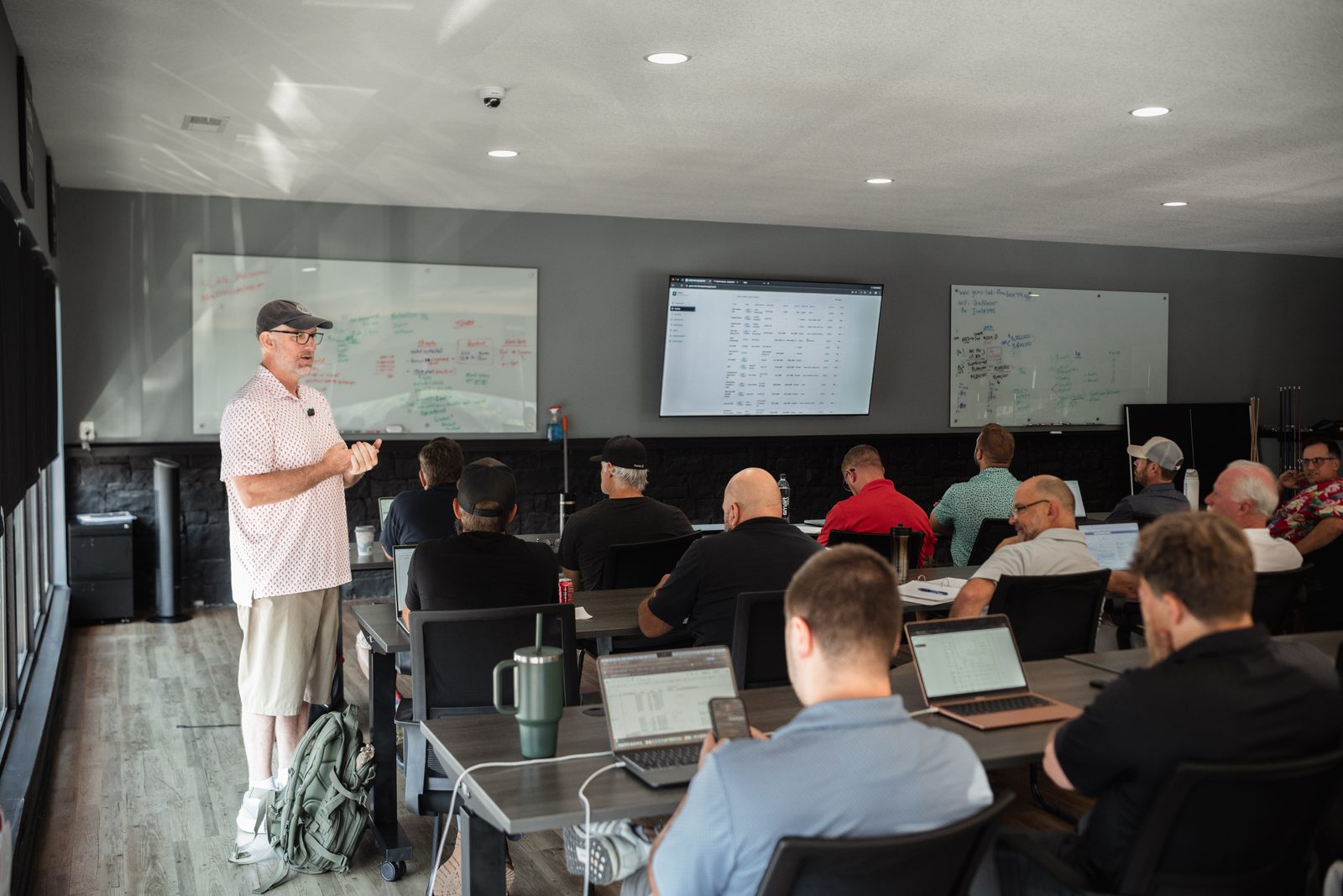 Jason Dillard teaching a room of agents at a Greenville Equity Marketing Sessions meeting